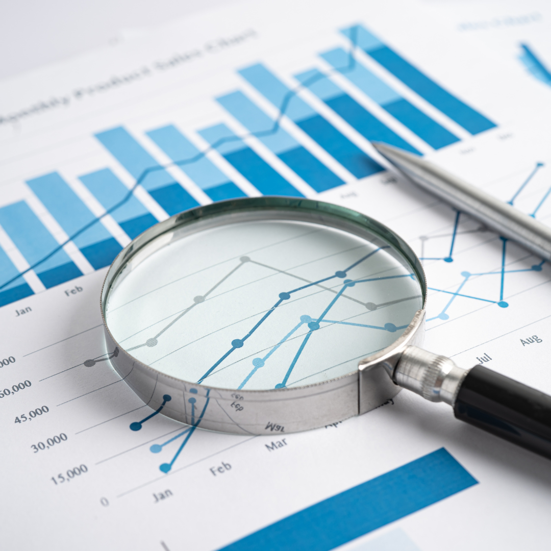 Magnifying glass on a chart, highlighting Aptimized's data focus.