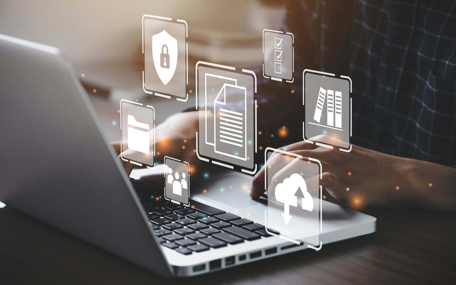 Person typing on a laptop with digital icons for data security, document management, and cloud services, highlighting cybersecurity.