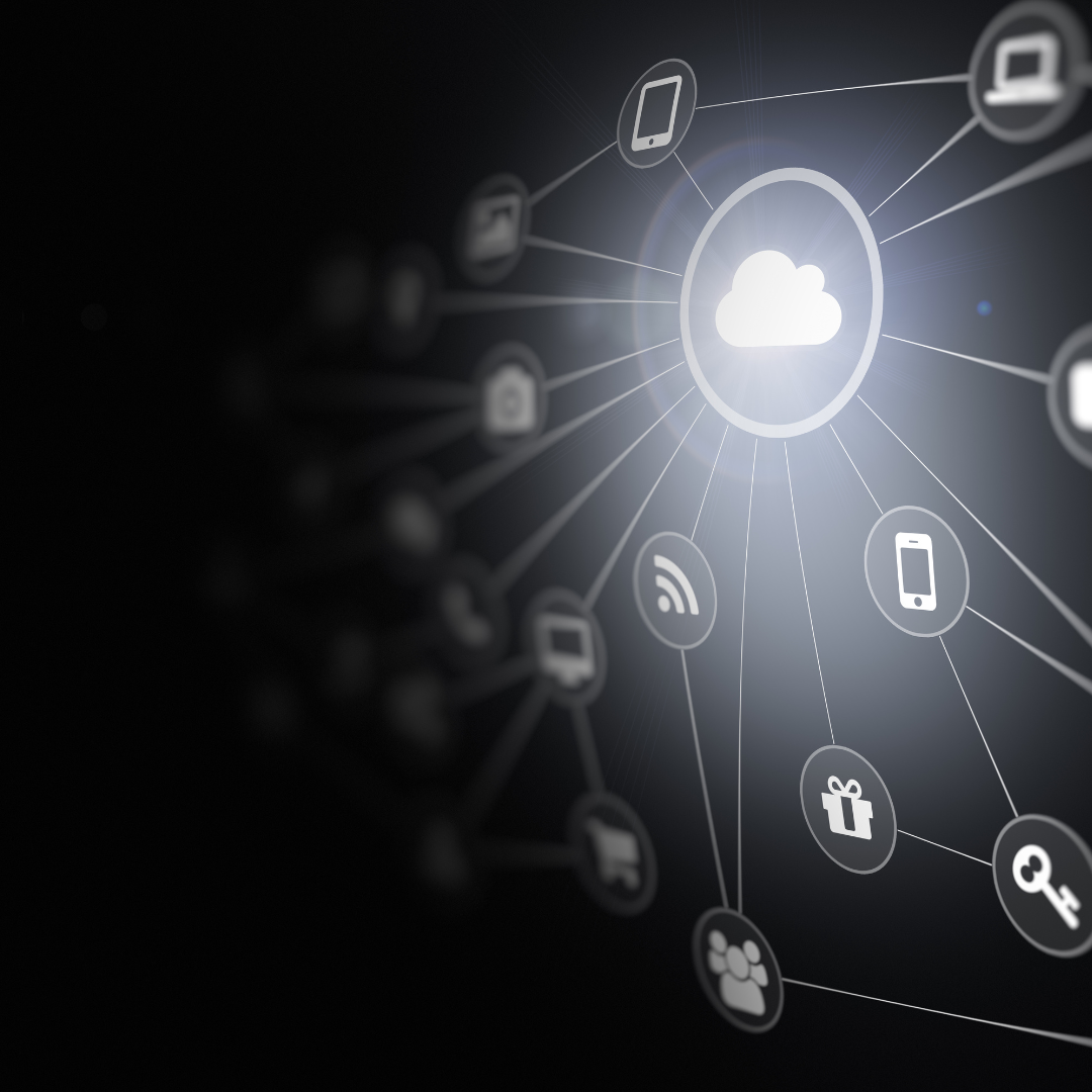 A glowing central cloud network with radiating device and service icons interconnected on a dark, sleek background.