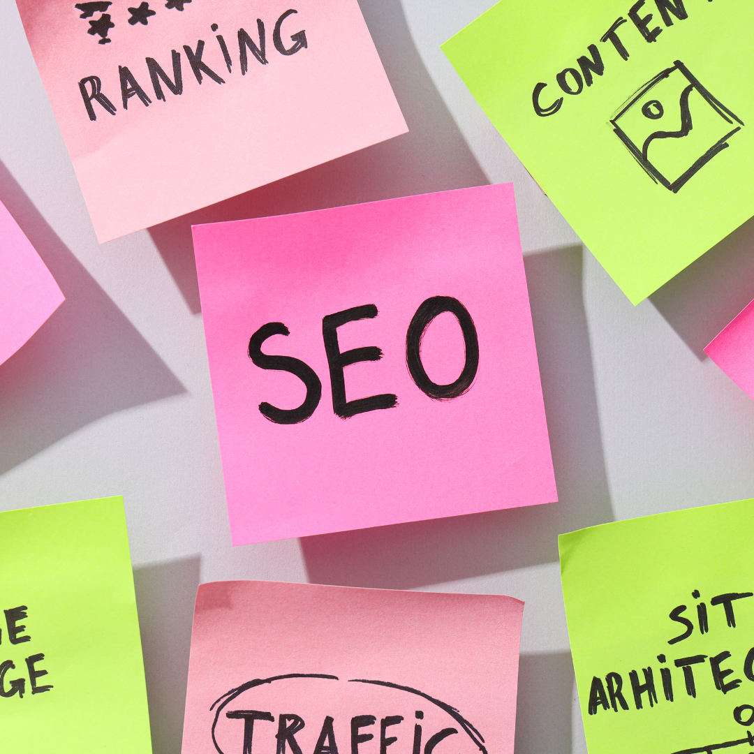 Sticky notes with keywords like SEO, ranking, and traffic, reflecting Aptimized's expertise in enhancing digital presence.